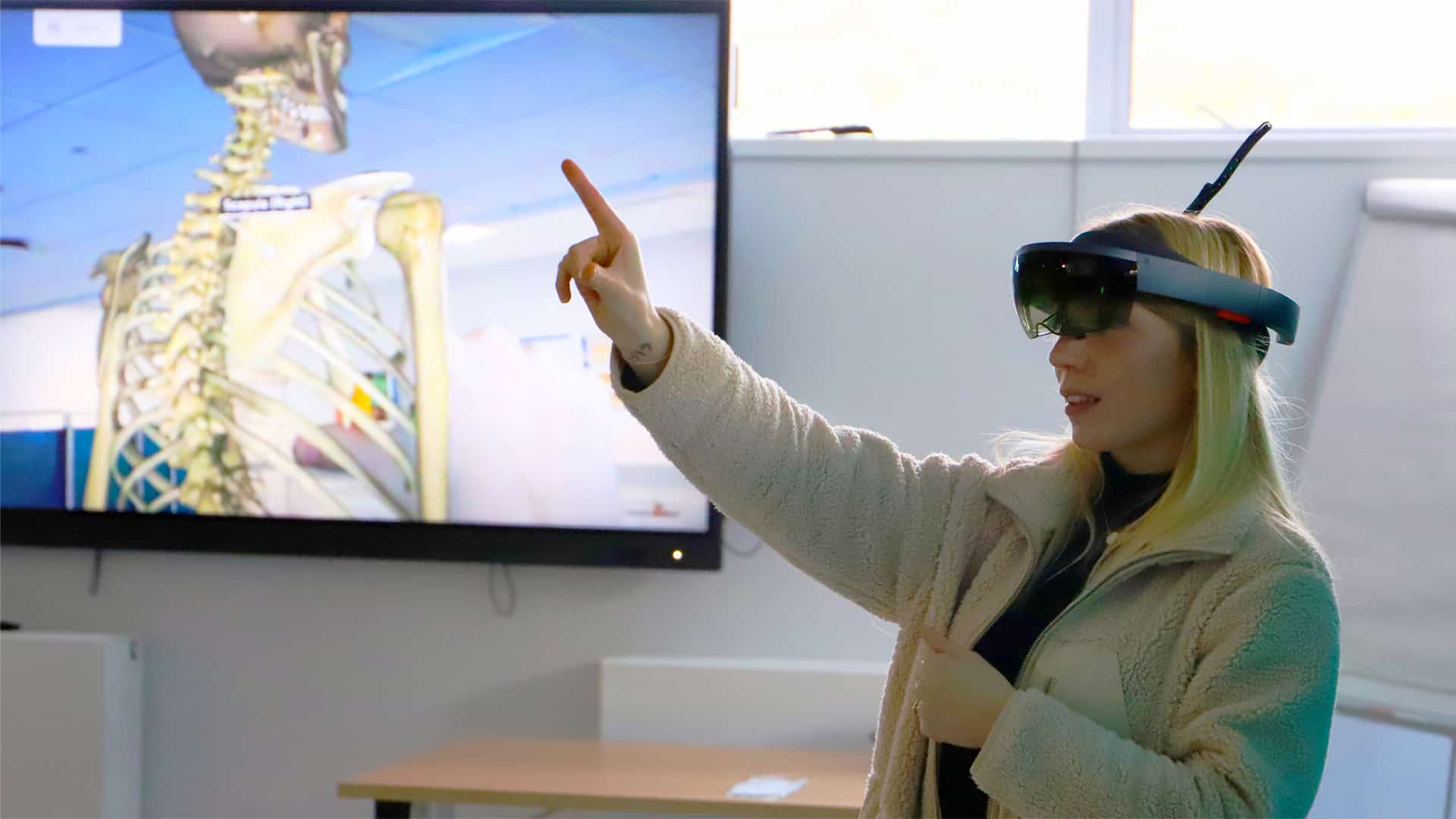 21 Nursing VR (Initial) Student using VR headset to examine a digital skeleton