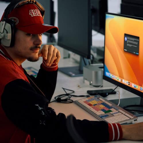 Game design student working on computer