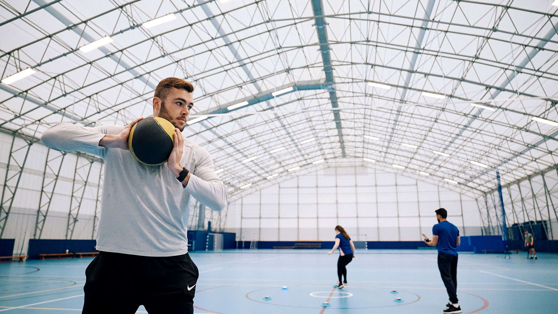 24 Strength And Conditioning student playing basketball in the Dome
